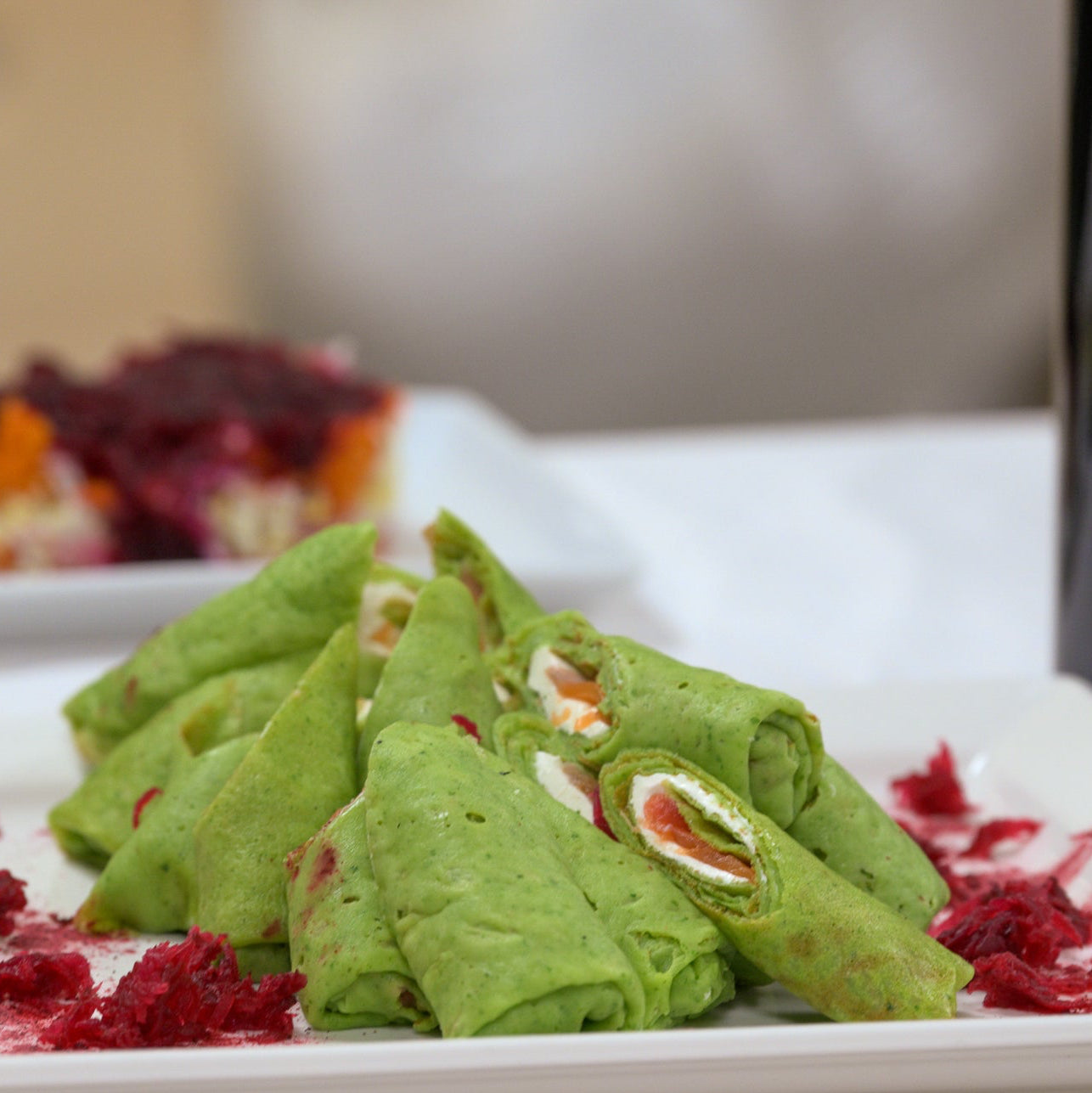 Traditional spinach crepes with salmon and cheese cream