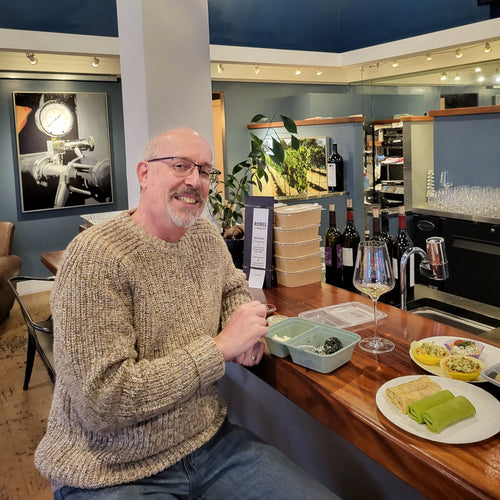 Hand-made black squid ink pierogi with salmon